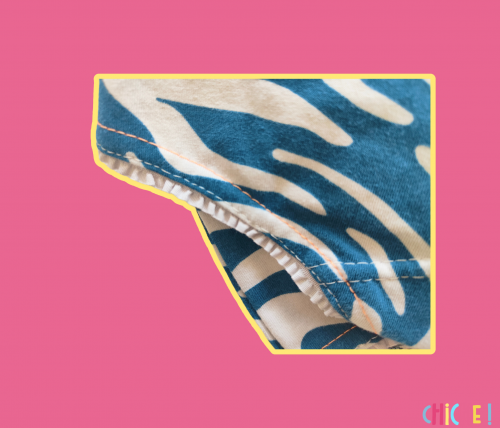 Cutout of the Chiche girls' boxer shorts with tiger stripe pattern. Detail of the fancy elastic.